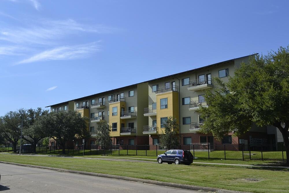 Two-story apartment buildings with shingle roofs
