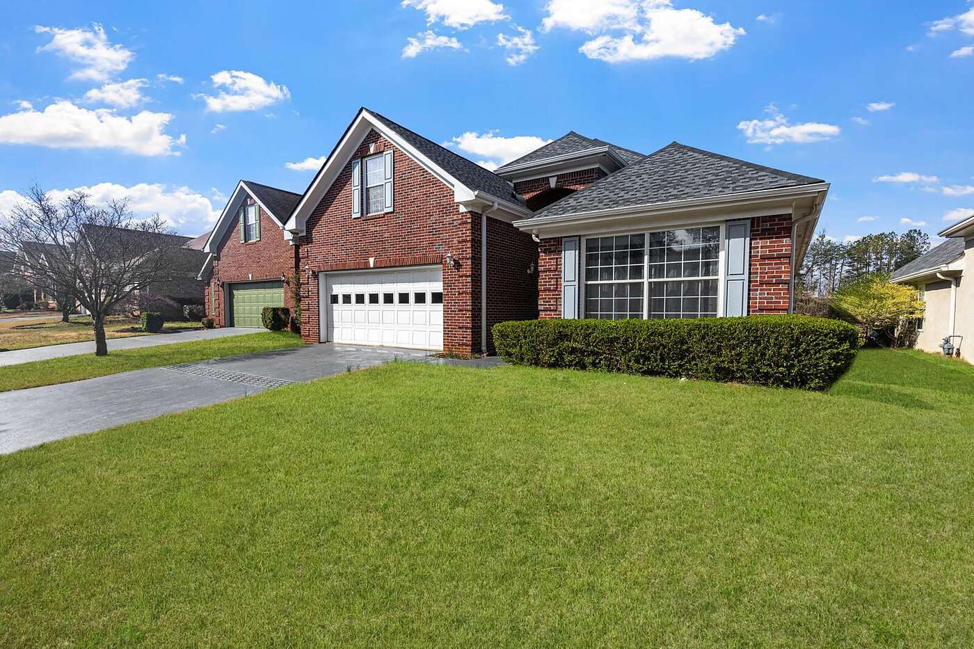 A 1960s brick ranch house with a low-pitched roof