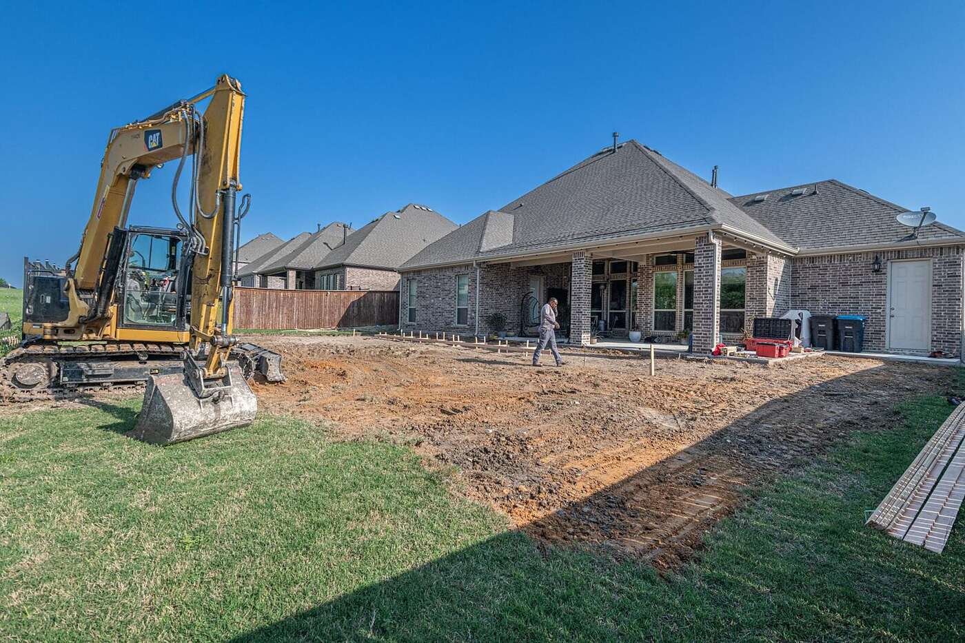 Newly built houses on a subdivision street with young trees